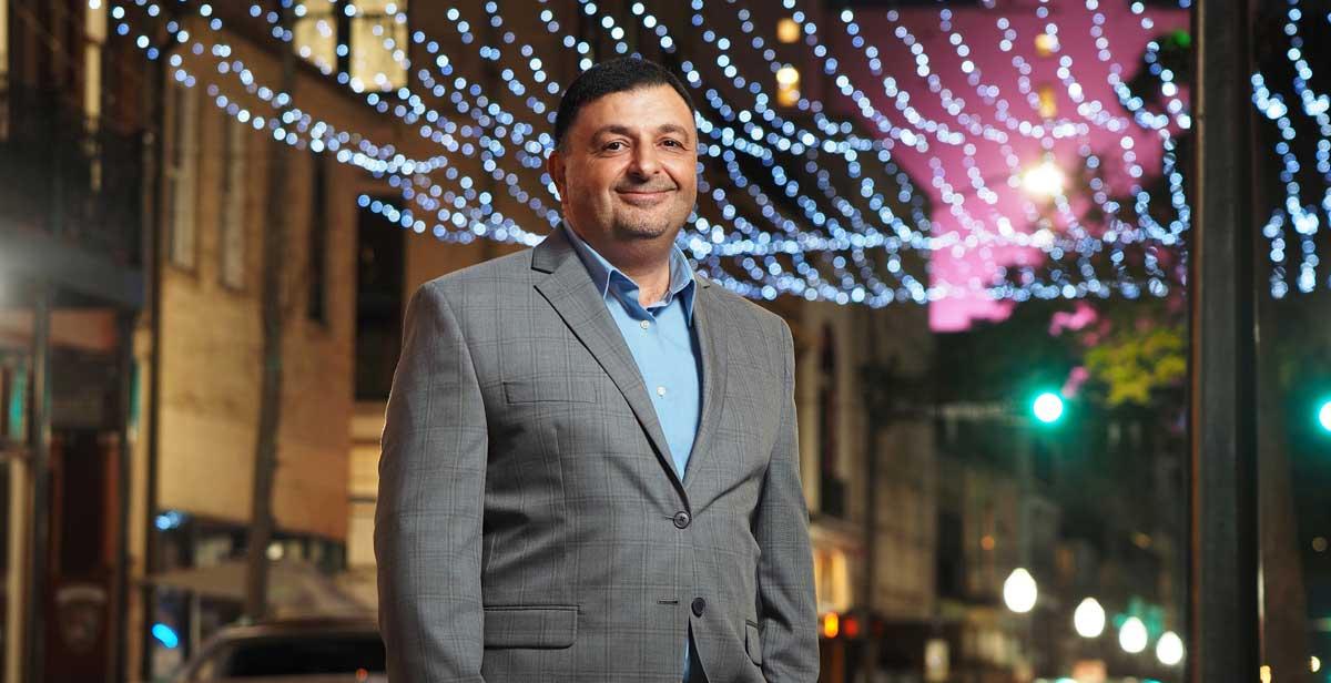 Dr. Khaldoon Nusair, the new department head for Hospitality and Tourism Management at the University of South Alabama, said the future of South's program includes specializations in the major. Here, Nusair stands in the middle of downtown Mobile's entertainment district – a popular draw for both locals and tourists with restaurants, music and event venues, and lodging.