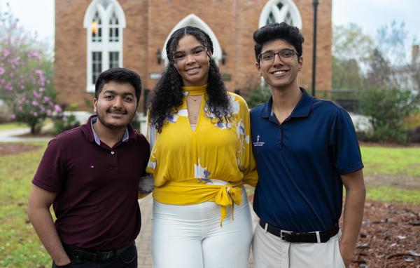 Three University of South Alabama Honor College students, from left, Suhas Patil, Kaitlyn Riggins and Dev Mehta, recently took third, second and first place in a competition for research posters at the Alabama Academy of Science Conference.